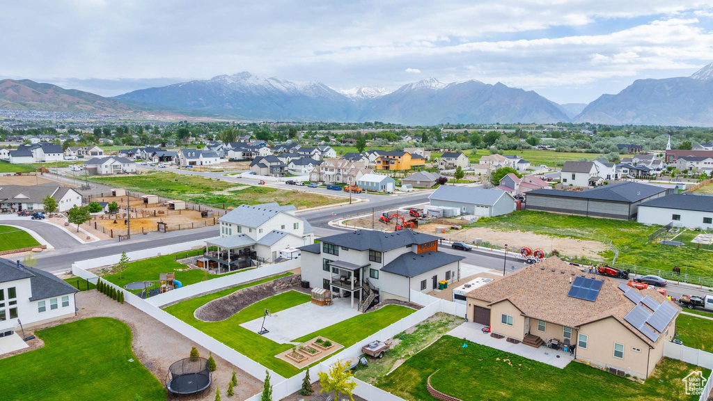 Aerial perspective of suburban area with a mountainous background