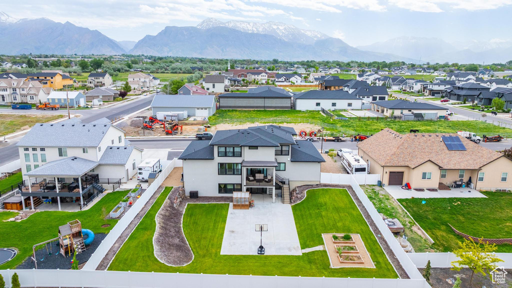 Aerial perspective of suburban area with a mountainous background