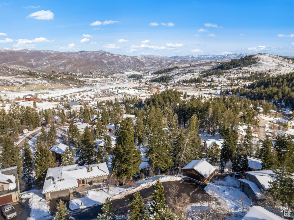 Snowy aerial view featuring a mountain view