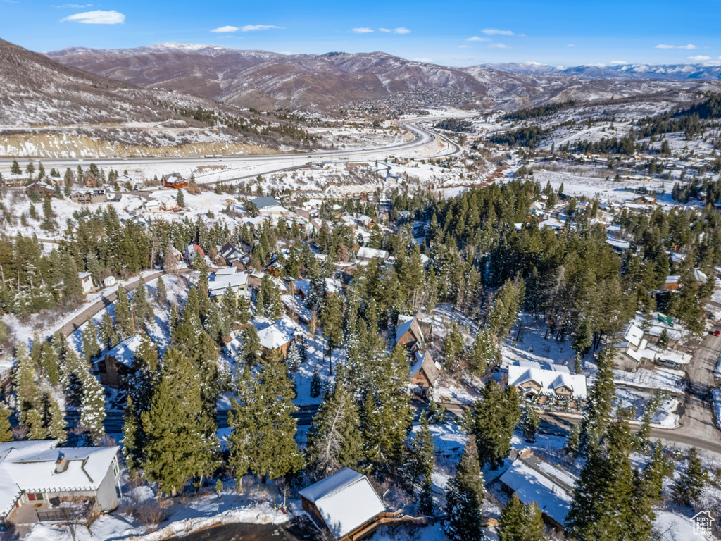 Snowy aerial view with a mountain view