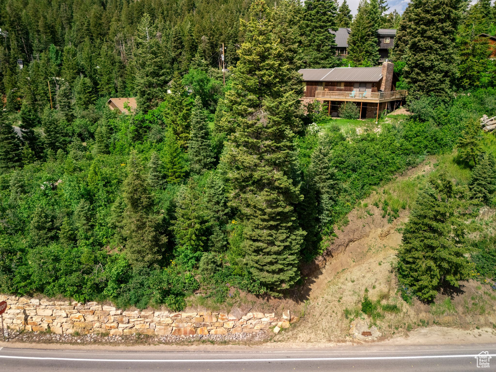 View from above of property with a forest