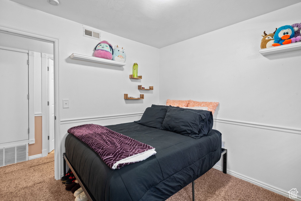 Bedroom with carpet and baseboards