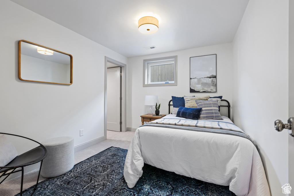 Carpeted bedroom with baseboards
