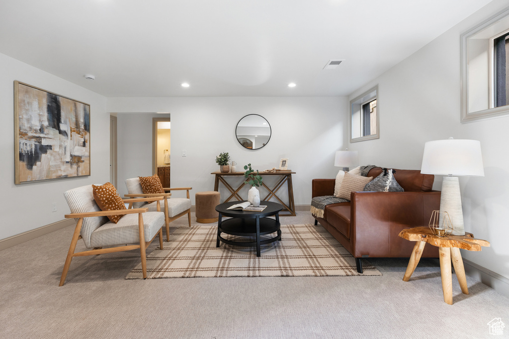 Living area featuring carpet, recessed lighting, and baseboards