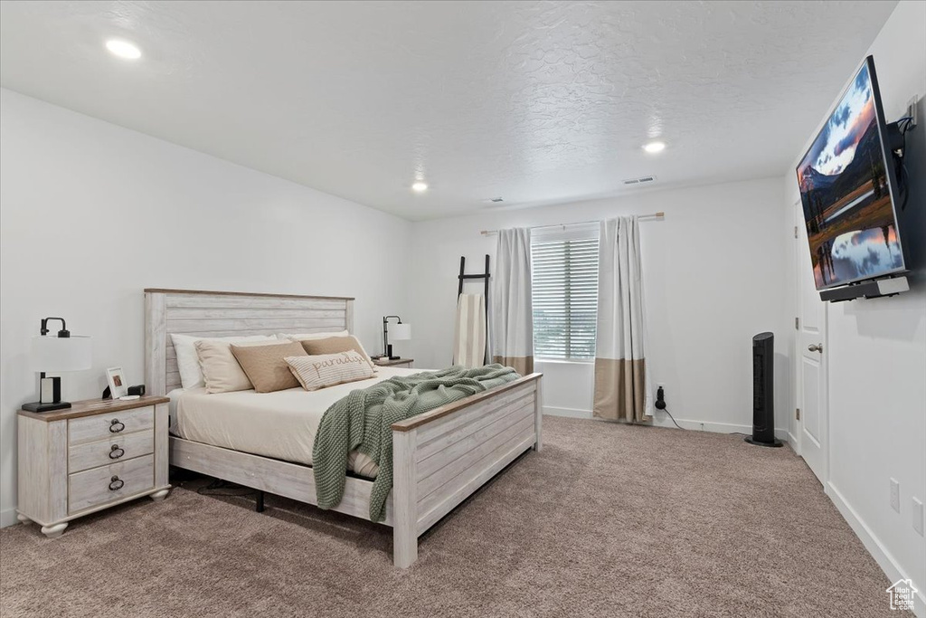 Bedroom featuring carpet, recessed lighting, and baseboards