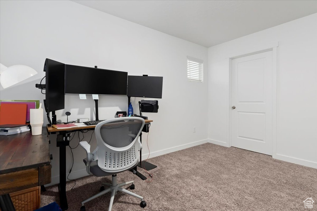Office area with carpet and baseboards