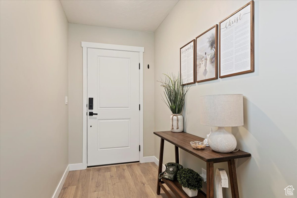 Entryway featuring light wood-style flooring and baseboards