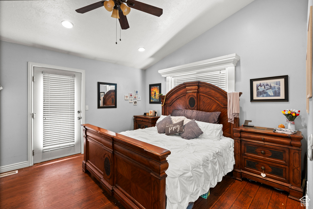 Bedroom with vaulted ceiling, dark wood finished floors, recessed lighting, and ceiling fan