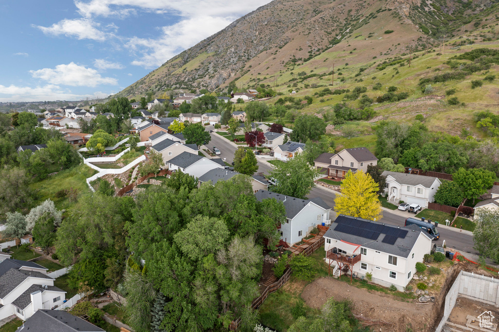 View of property location featuring nearby suburban area and a mountain backdrop