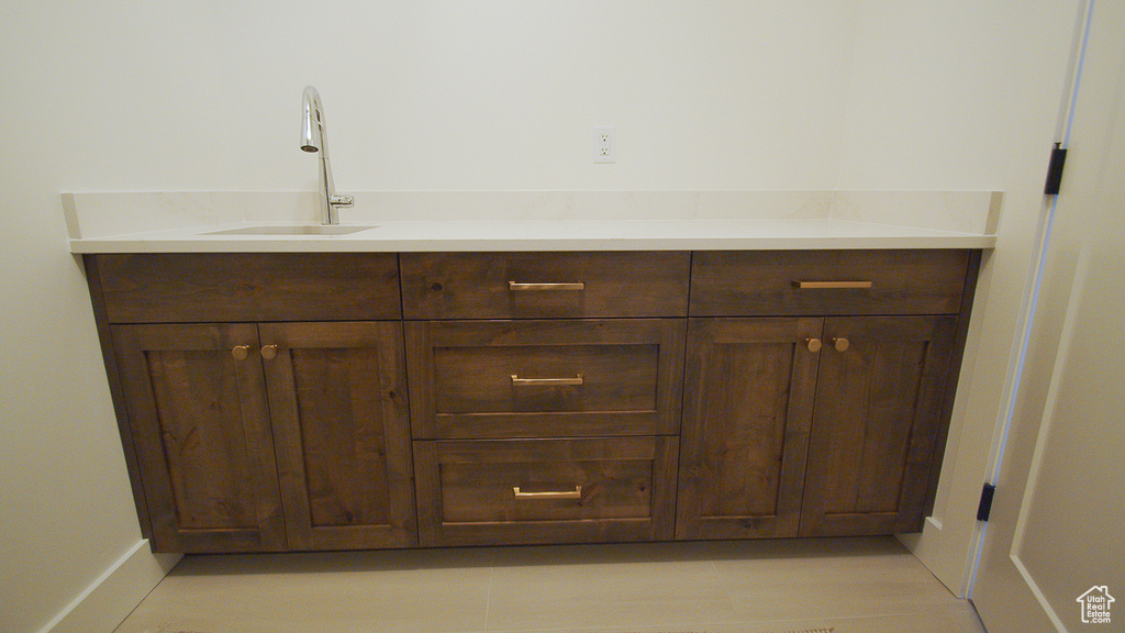 Bathroom with a sink and baseboards