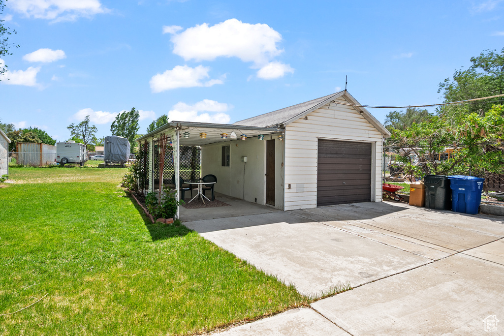 Garage with driveway and a garage