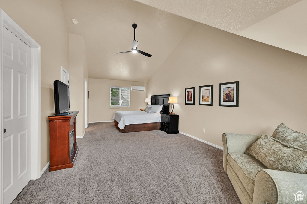 Carpeted bedroom with baseboards, an AC wall unit, high vaulted ceiling, and ceiling fan