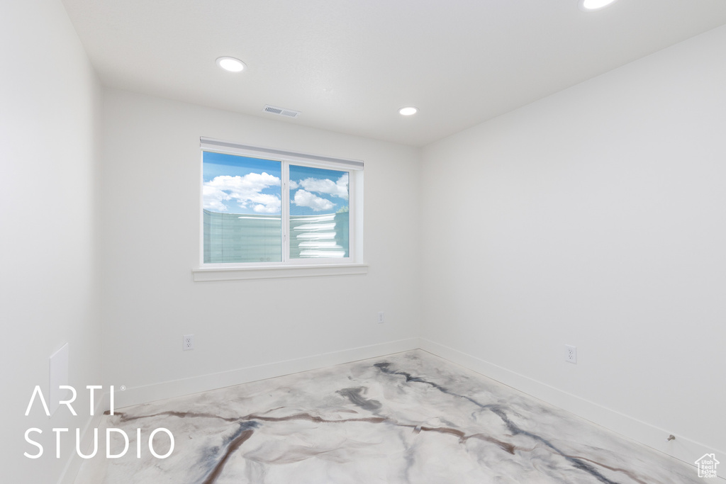Unfurnished room featuring recessed lighting and baseboards