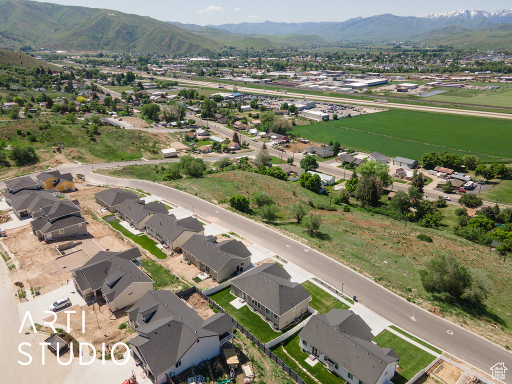 Aerial perspective of suburban area with a mountain backdrop
