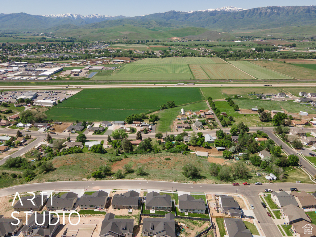 View of property location with mountains, large plots for crops, and rural landscape