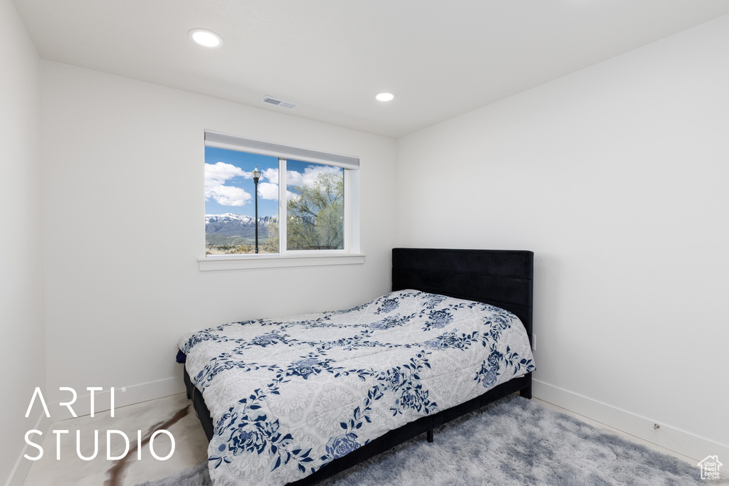 Carpeted bedroom featuring baseboards and recessed lighting