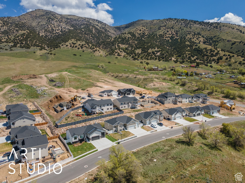 View of property location featuring nearby suburban area and a mountain backdrop