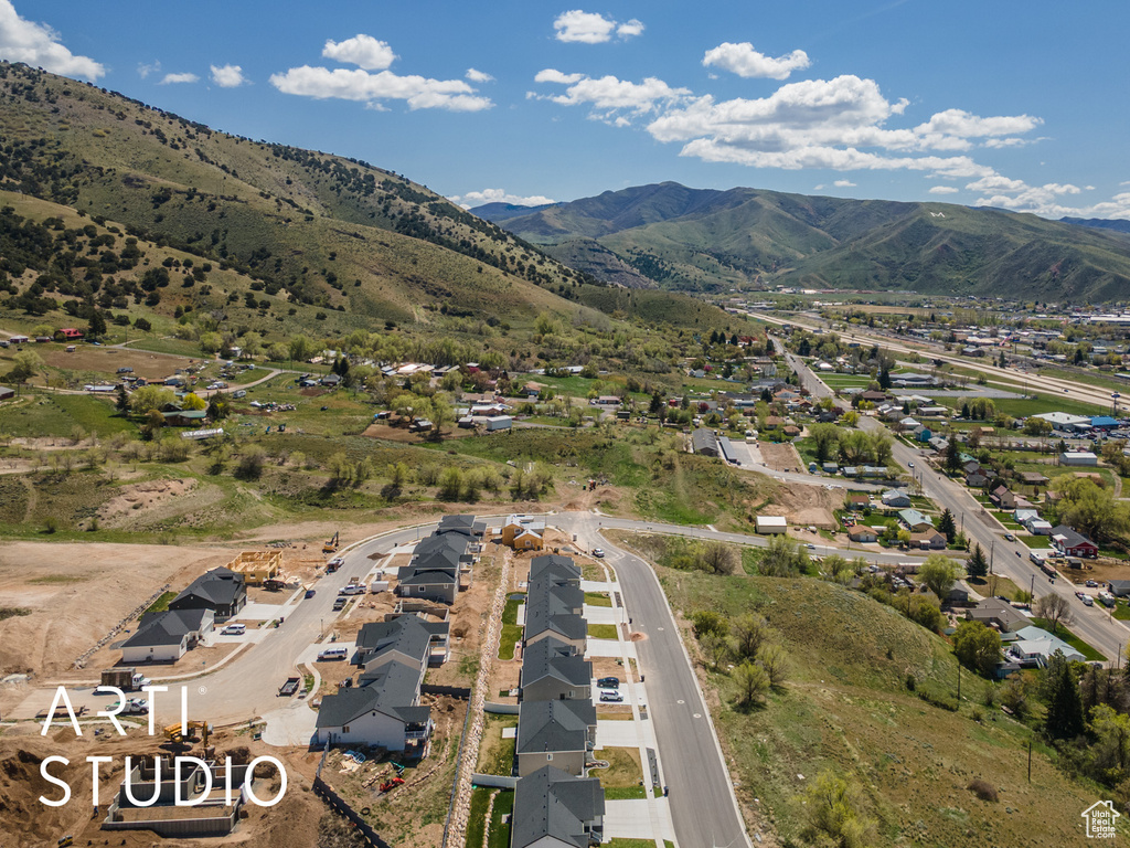 Aerial view of property\\\'s location with a mountain backdrop and nearby suburban area