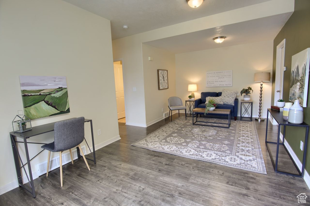 Living room with wood finished floors and baseboards