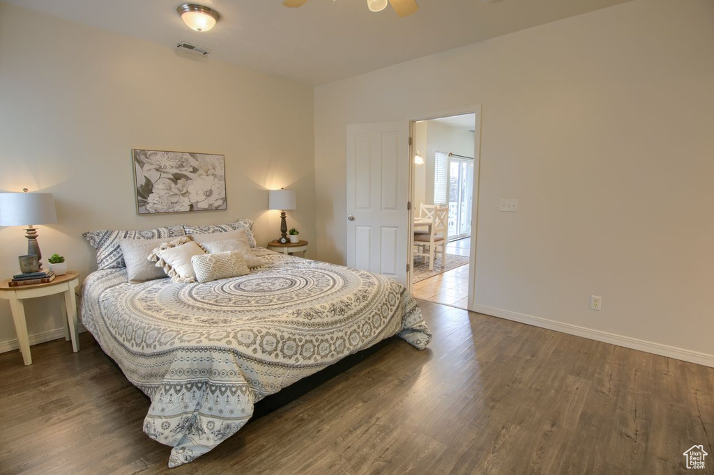 Bedroom featuring baseboards and wood finished floors