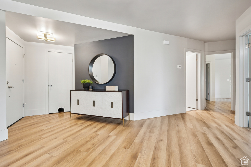 Foyer entrance featuring wood finished floors and baseboards