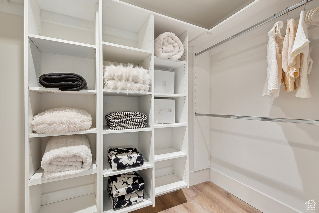 Spacious closet with wood finished floors
