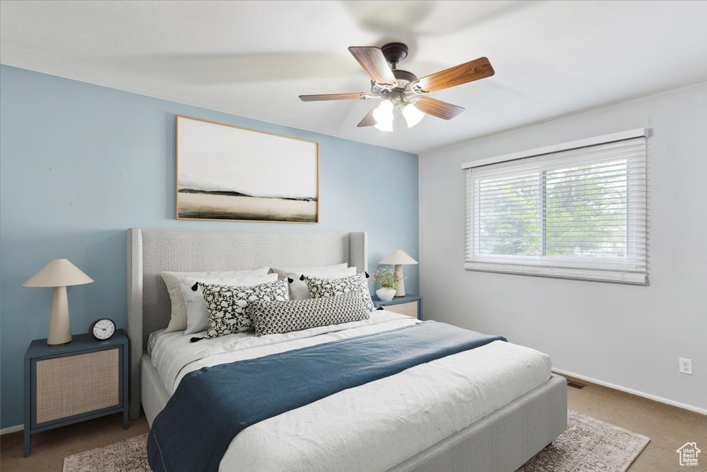 Bedroom with carpet and ceiling fan
