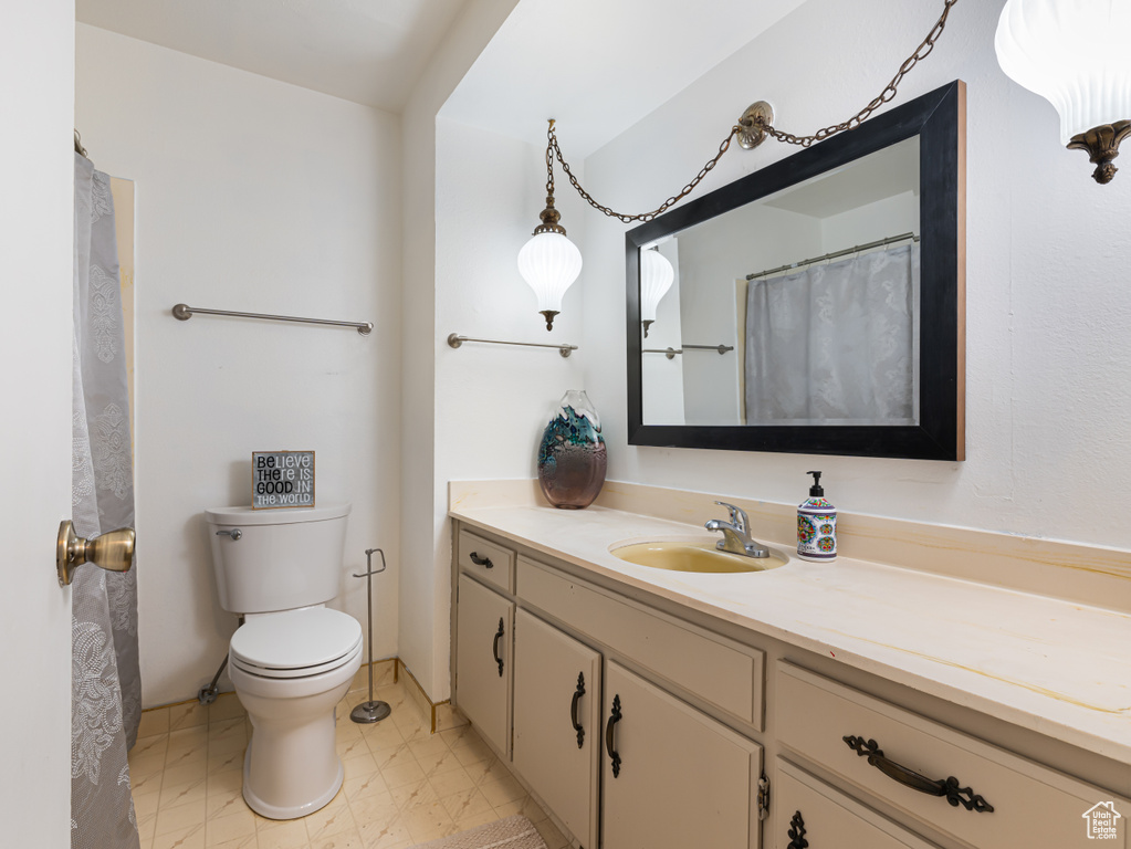 Full bath with vanity and toilet