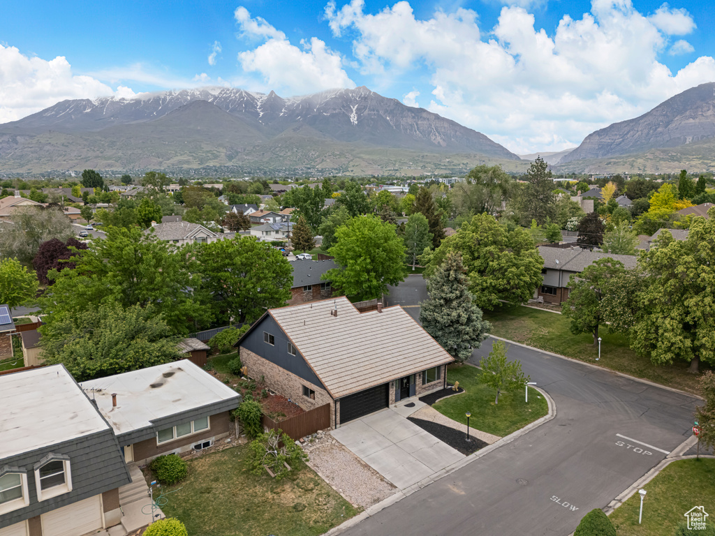 Aerial perspective of suburban area featuring a mountainous background
