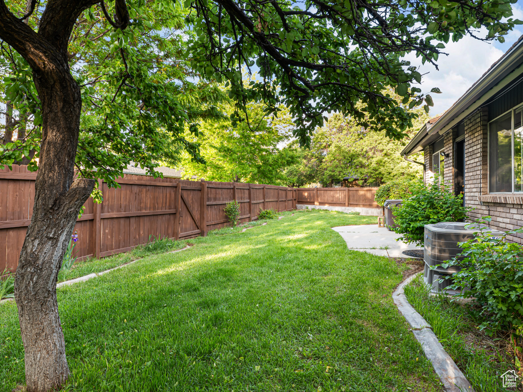 View of yard with central AC