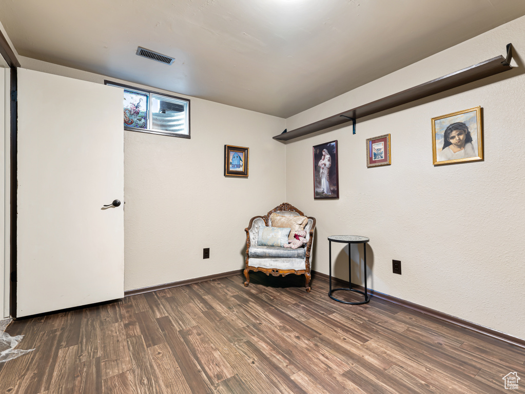 Sitting room featuring wood finished floors and baseboards
