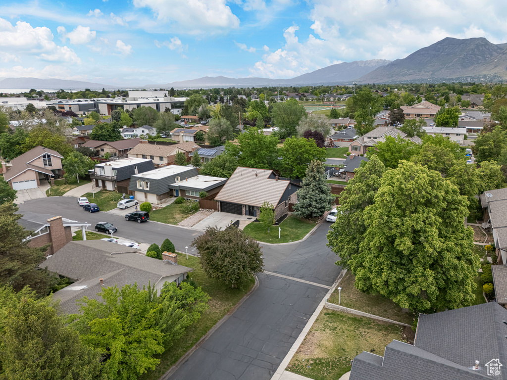 Aerial perspective of suburban area featuring a mountain backdrop