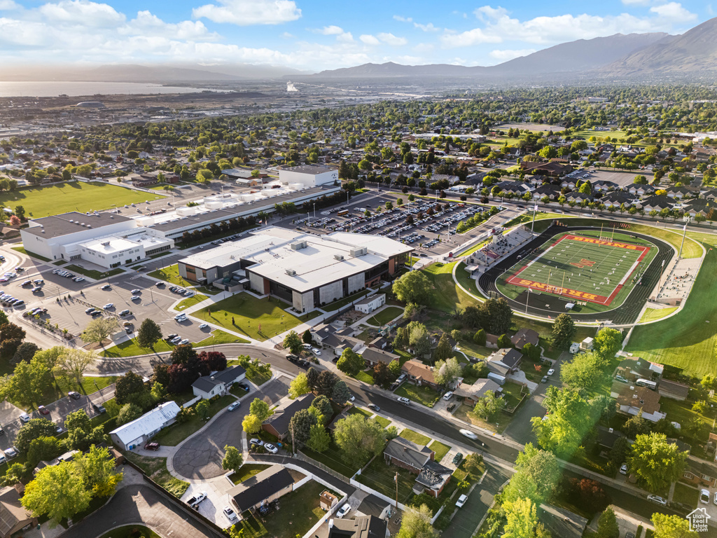 Aerial view of property's location with a mountainous background