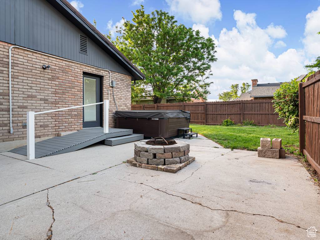 View of patio / terrace featuring a hot tub