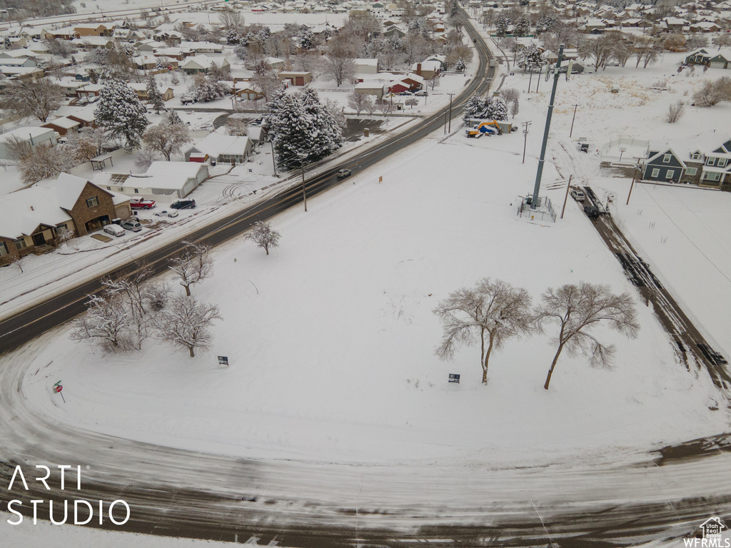 Snowy aerial view with a residential view