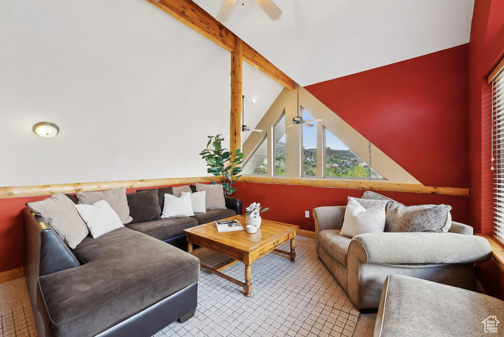 Living room featuring ceiling fan and baseboards