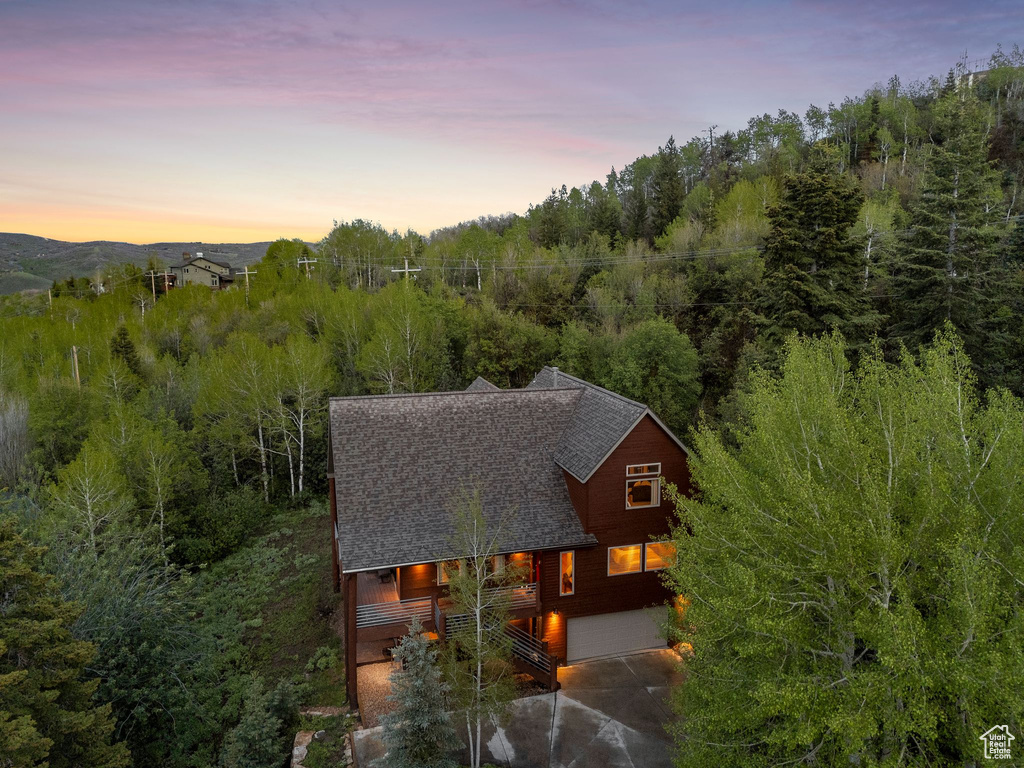 View from above of property featuring a heavily wooded area
