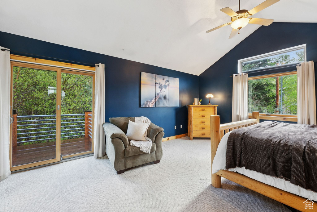 Carpeted bedroom featuring access to exterior, multiple windows, high vaulted ceiling, a ceiling fan, and baseboards