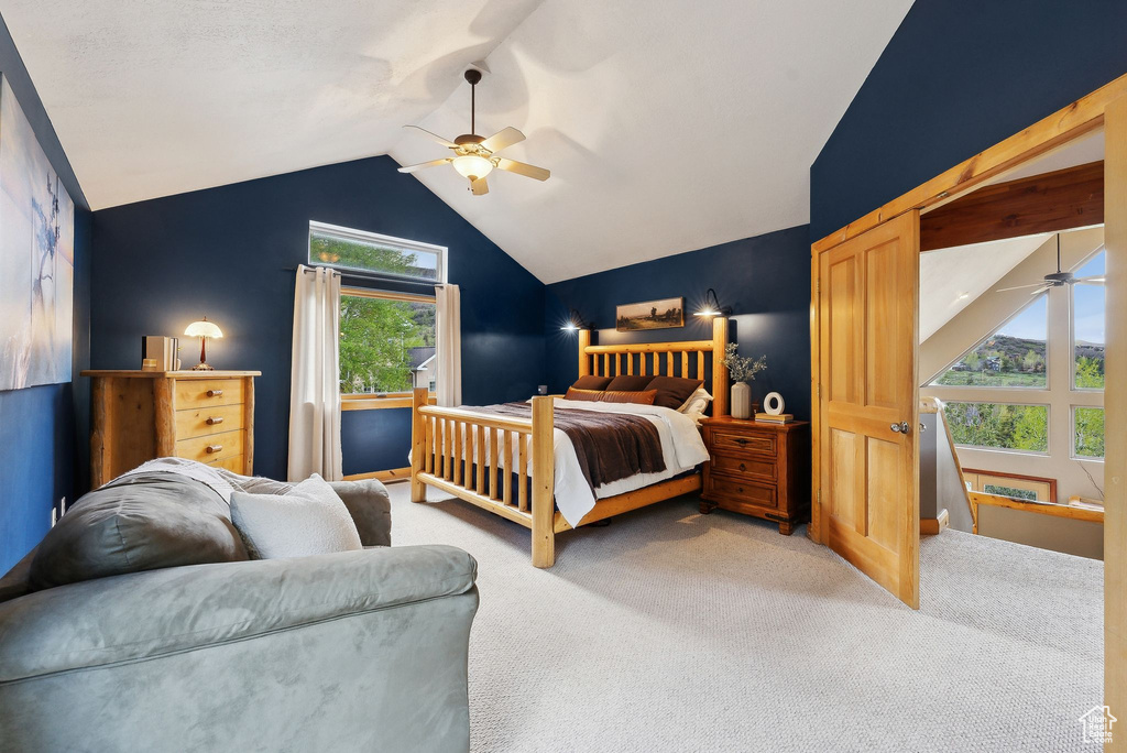 Bedroom with carpet, lofted ceiling, and ceiling fan