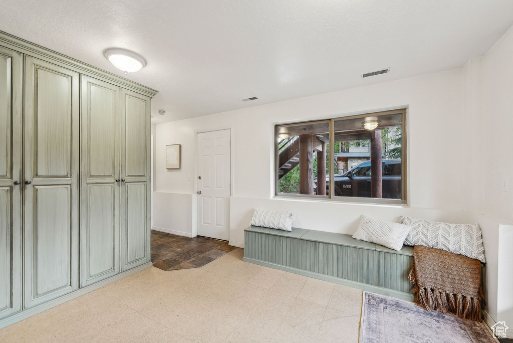 Sitting room featuring tile patterned floors