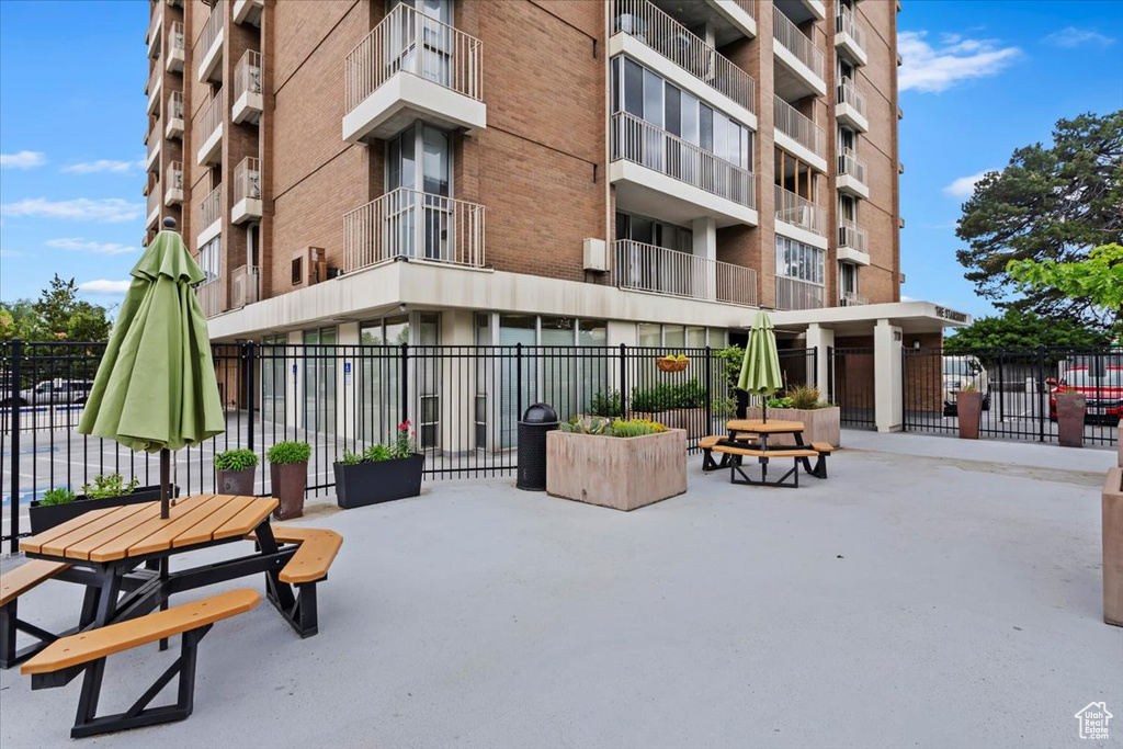 View of apartment building / complex with fence