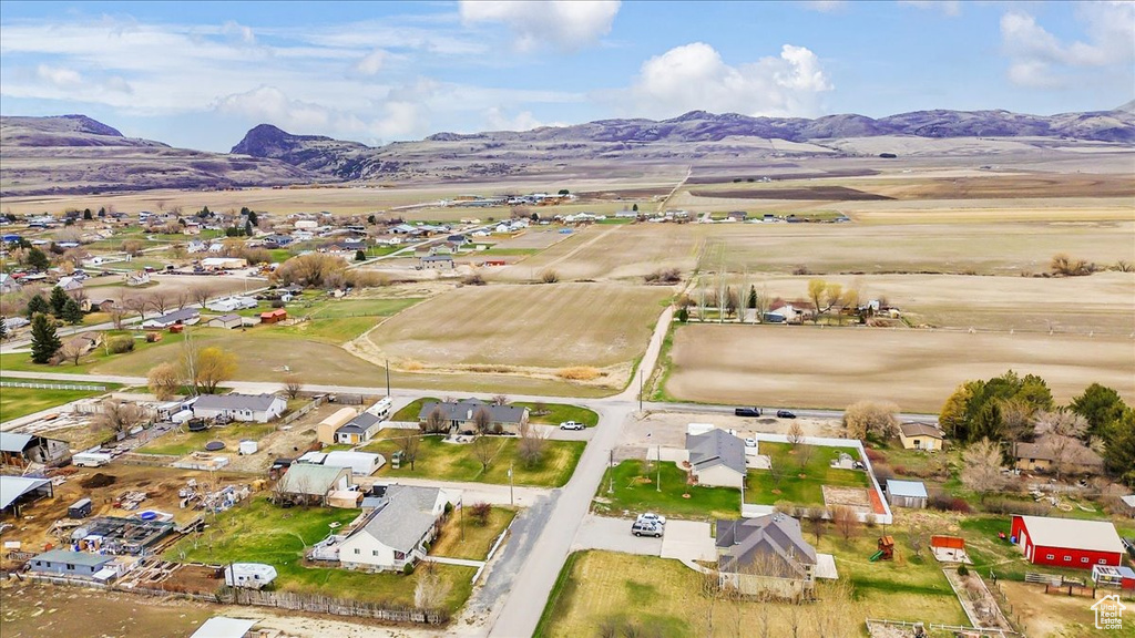 View of property location with a mountainous background and nearby suburban area