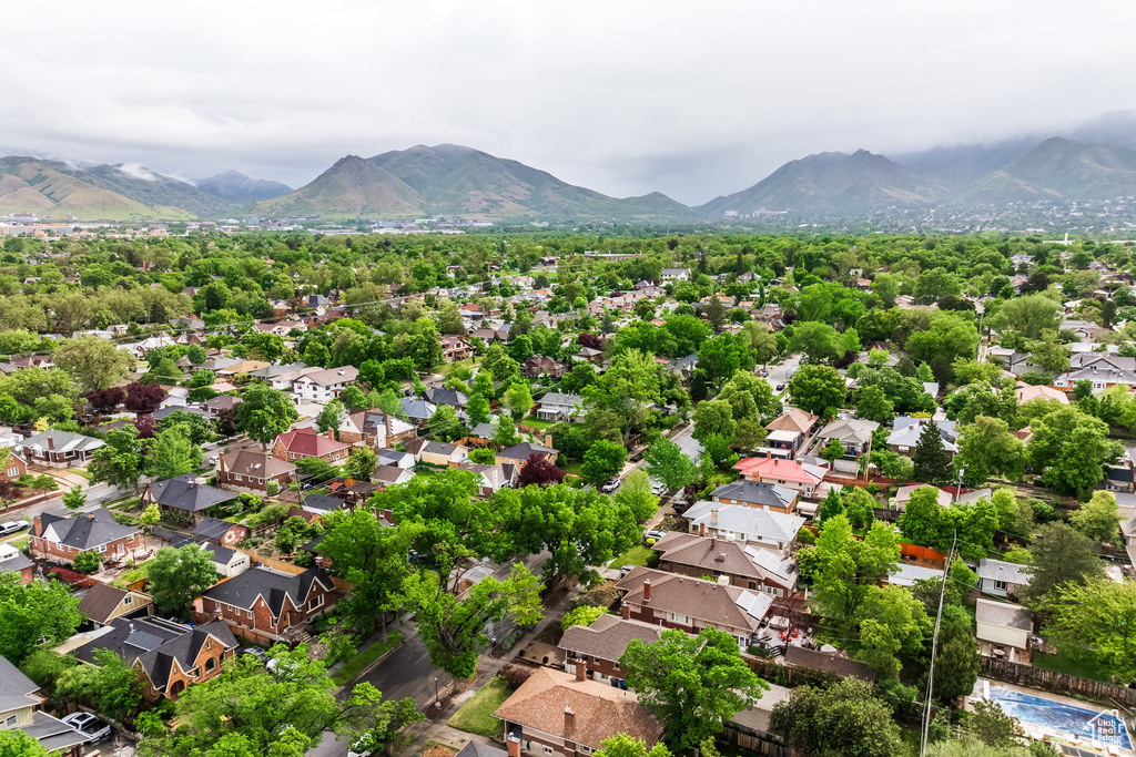 Aerial perspective of suburban area featuring a mountain backdrop