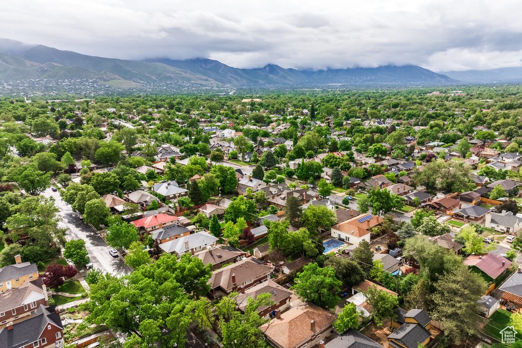 Aerial perspective of suburban area with a mountain backdrop