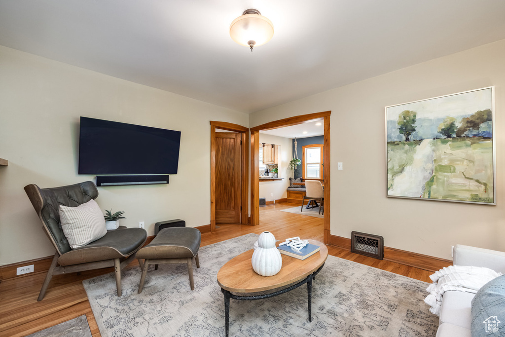 Living room with wood finished floors and baseboards