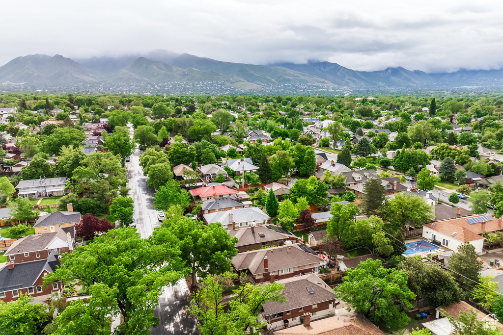 Aerial perspective of suburban area featuring a mountainous background