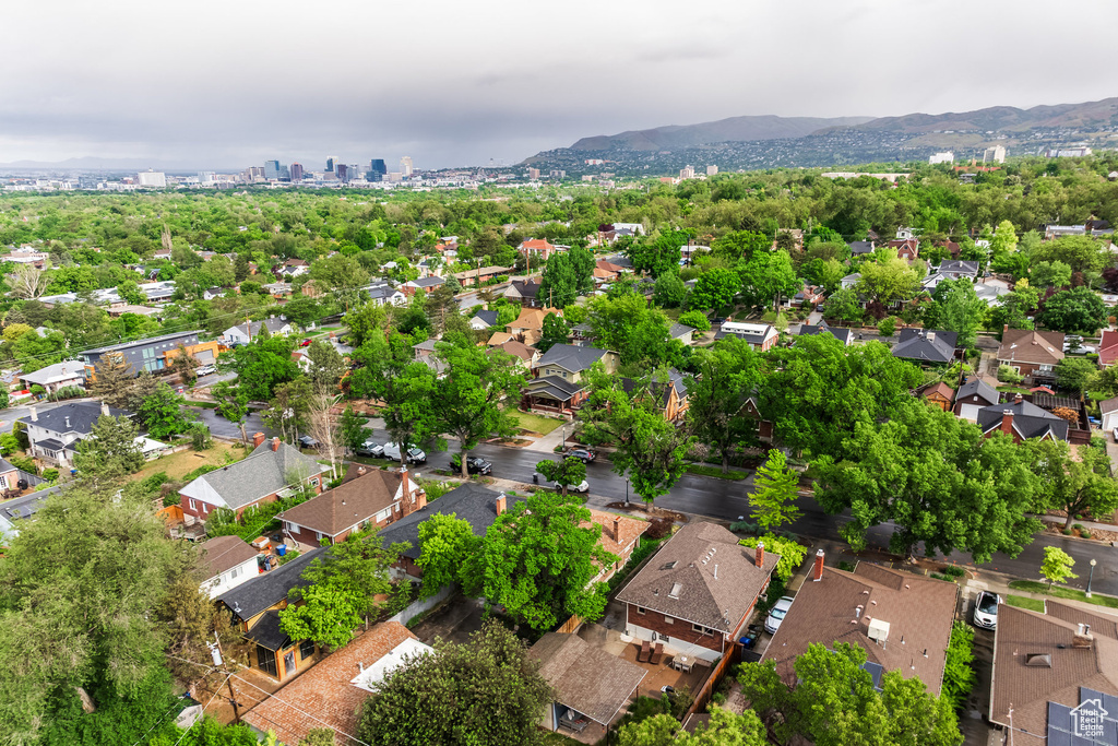 Aerial perspective of suburban area with a mountain backdrop