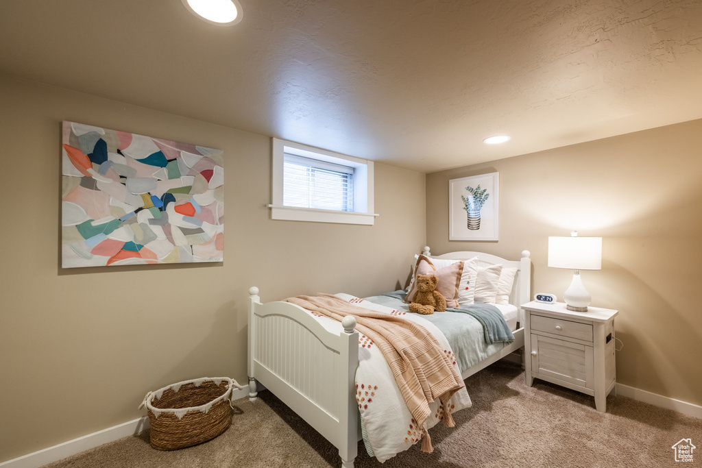 Carpeted bedroom featuring baseboards and recessed lighting