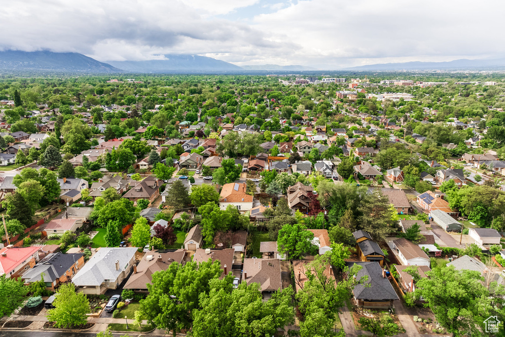 Aerial view of residential area featuring a mountain backdrop