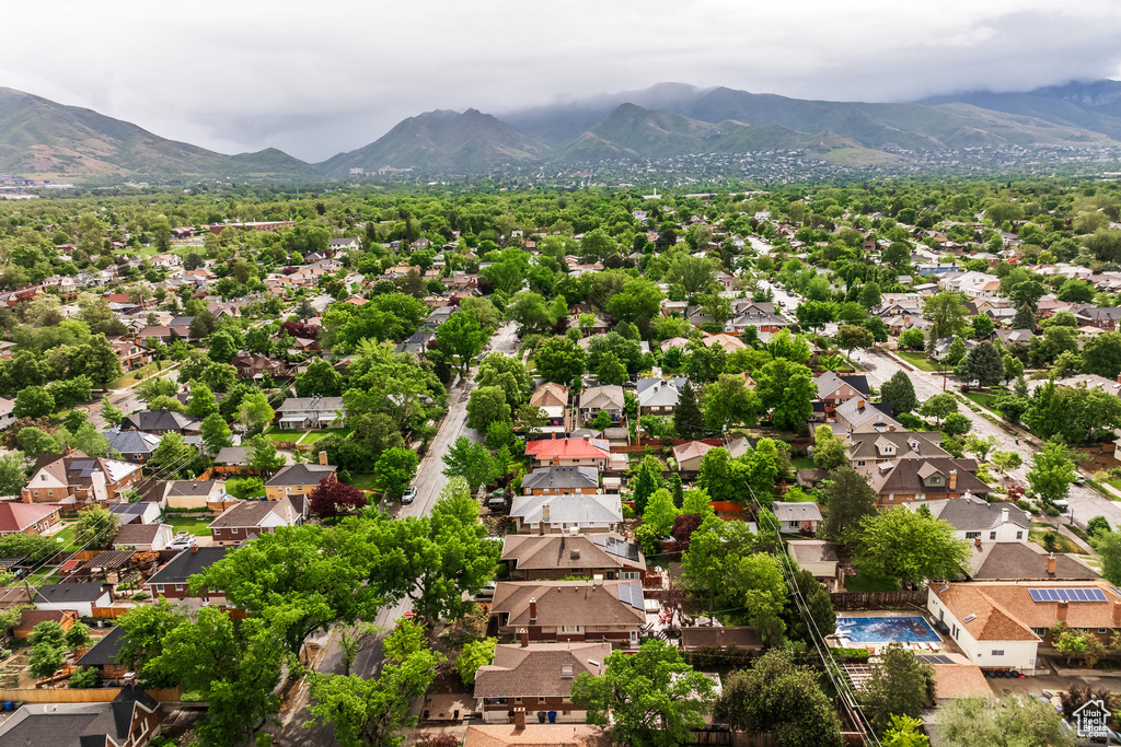 Aerial perspective of suburban area with a mountain backdrop